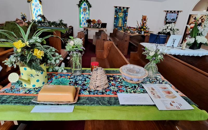 Megan Broome/The Clayton Tribune. Important facts about Honeybees were on display at St. James Episcopal Church.