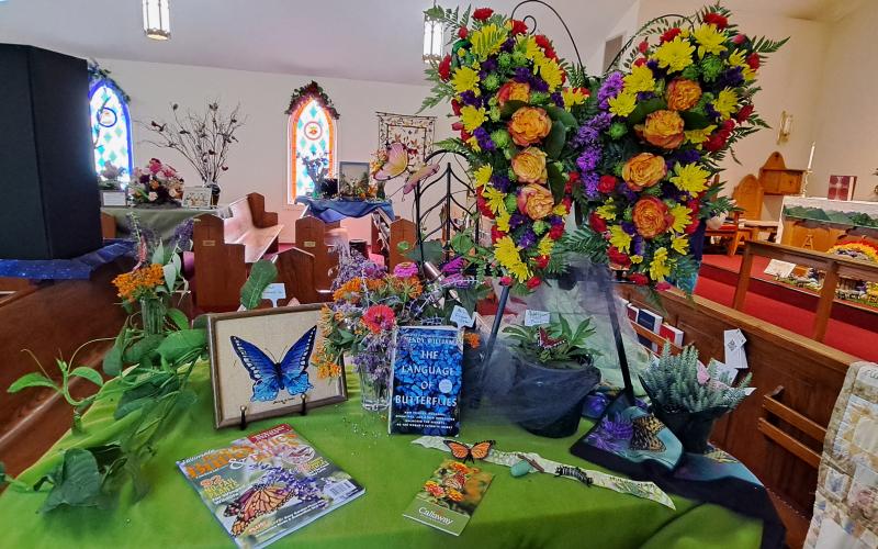 Megan Broome/The Clayton Tribune. "Butterflies and Metamorphosis" in a floral arrangement was able to be viewed during the festival.