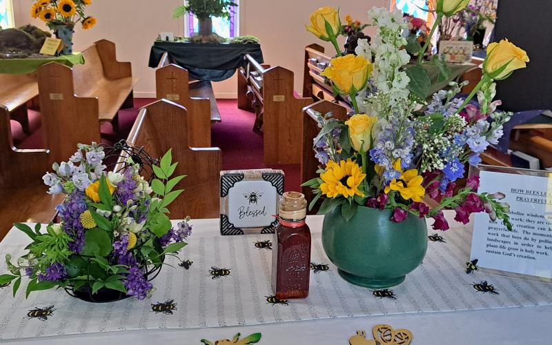 Megan Broome/The Clayton Tribune. This display gives information on how Bees lead to a prayerful life.