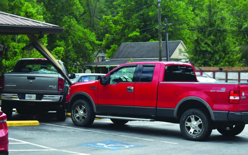 Luke Morey/The Clayton Tribune. Three-vehicle crash also strikes Andy’s Market on May 30 in Clayton.