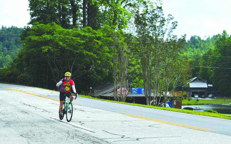 Luke Morey/The Clayton Tribune. Arie van Hooren from Lake Worth, Fla., gives a salute as he prepares to pull into LaPrade’s Marina for the second rest stop of the day.