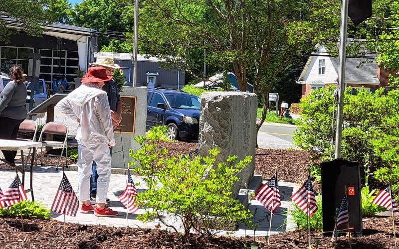 Megan Broome/The Clayton Tribune. Eddie and Jane Bingham reflects at the soldiers' memorial following the Memorial Day Ceremony at the Rabun County Courthouse Monday, May 29.