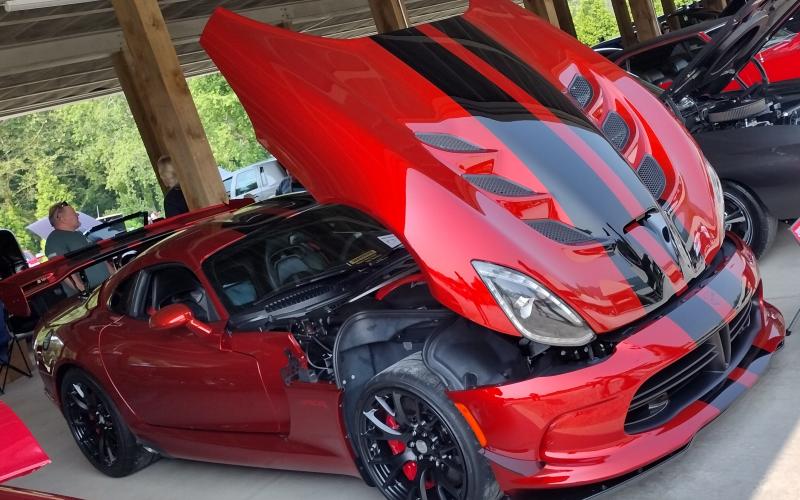 Photo courtesy Conner Horn. This Dodge Viper owned by Don West was voted Best Modern Ride (2000 and up) at the inaugural "Rumble in Rabun" car and bike show last weekend.  Left: Show judge Jason Whitmire talks with Bruce Martin from Rabun Gap about his Wood Doodlebug Chevette.