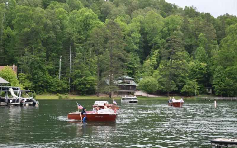 Megan Broome/The Clayton Tribune. A closeup of one of the 32 wooden boats that set sail on Lake Burton Sunday, May 28.