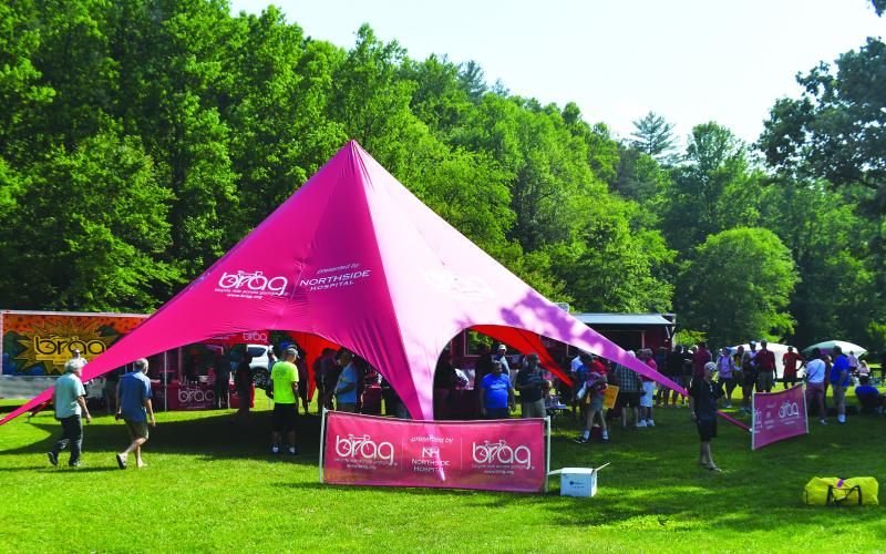 Luke Morey/The Clayton Tribune. Riders could check in and get information about destinations in Clayton under a BRAG canopy on Saturday, June 3.