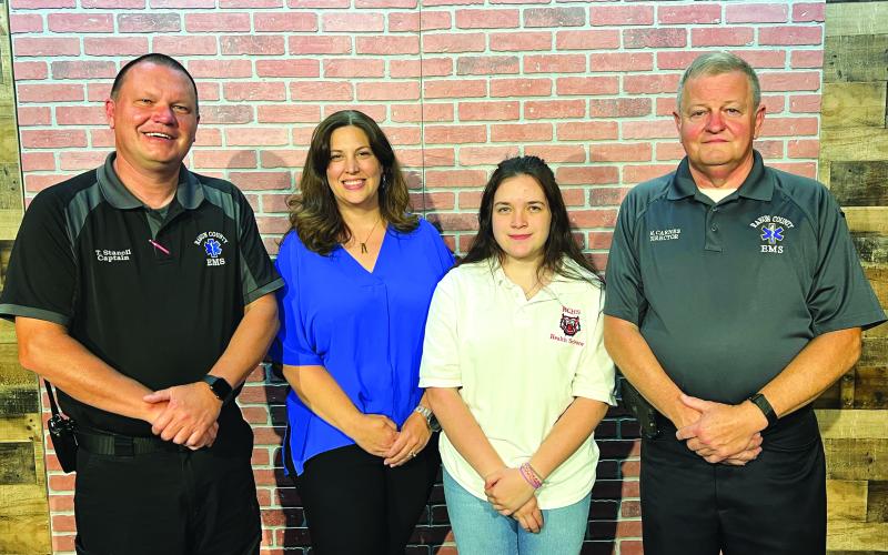 Submitted photo. RCHS graduate Taylor Rogers successfully completed the Emergency Medical Responder (EMR) Course and passed her National Registry Exam. Pictured are Trampes Stancil, instructor; Alicia McCracken, RCHS health science teacher; Rogers; and Mike Carnes, EMS/911 director.