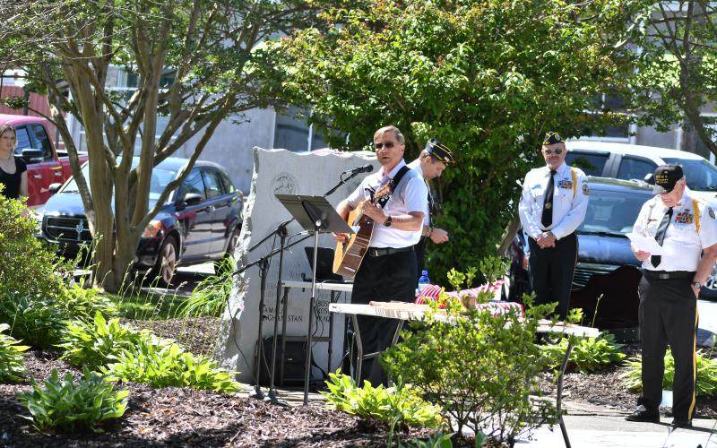 Megan Broome/The Clayton Tribune. Greg Funkhouser performs his original song "Thank you for Answering the Call."