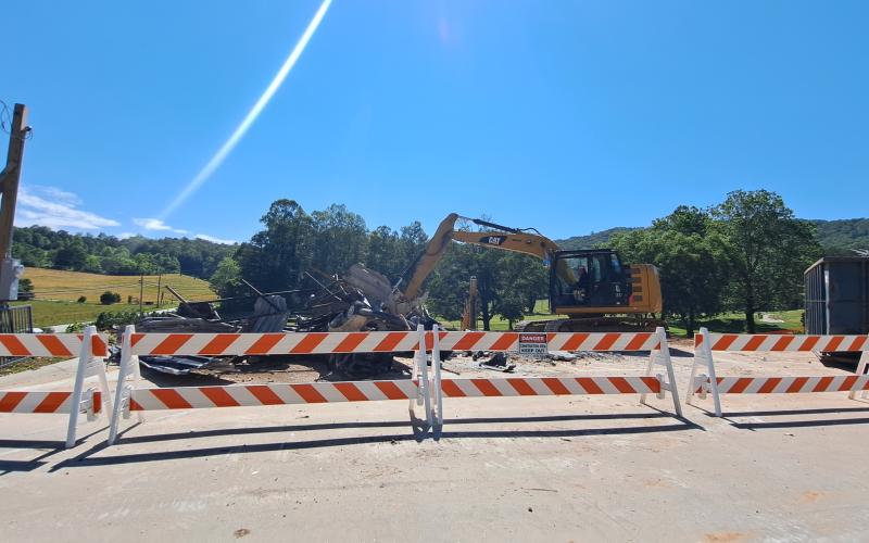 Tom Adams Construction, of Rabun Gap, works to demolish the Rabun County Golf Club building. Demolition is underway after the strength of the building was compromised following a Dec. 23, 2021, structure fire. The building will be built back similarly with the golf carts relocated to the maintenance shed.