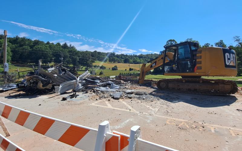 Tom Adams Construction, of Rabun Gap, works to demolish the Rabun County Golf Club building. Demolition is underway after the strength of the building was compromised following a Dec. 23, 2021, structure fire. The building will be built back similarly with the golf carts relocated to the maintenance shed.