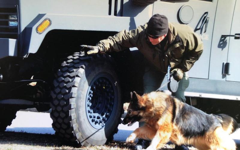 Submitted photo. K9 Handler John Crane works with partner K9 Pinda during their  law enforcement career. The pair worked as a team from 2010-2017. Pinda recently passed away at age 14.