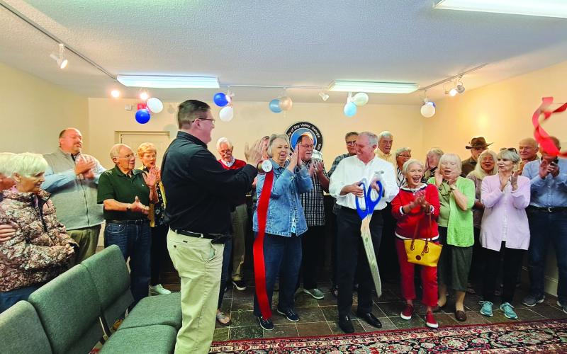 Megan Broome/The Clayton Tribune. City of Sky Valley officials, community members and Forward Rabun/Rabun County Chamber of Commerce cut the ribbon on the new location for Sky Valley City Hall Friday, May 26.