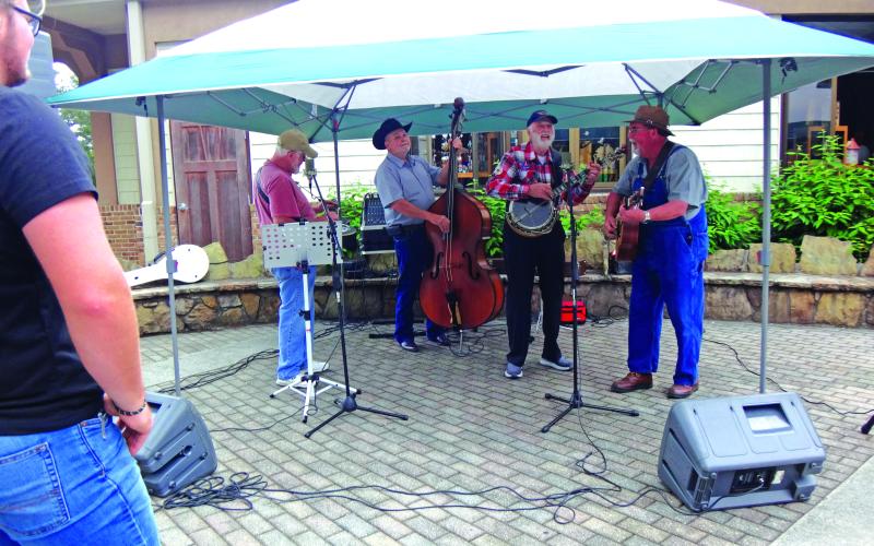 Submitted photo. The Tallulah Falls Band members Kerry Cash, of Mount Airy, on Dobro (from left); Bryan Addis, of Mount Airy, upright bass; Ben Johnson, of Gum Log, banjo; and Stanley Starnes, of Lawrenceville, guitar play at the Tallulah Gorge State Park’s 30th anniversary. The band has been together for 22 years and plays on Saturday nights in the Tallulah Falls city park.