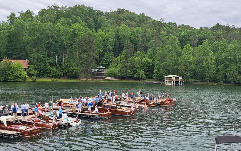 Megan Broome/The Clayton Tribune. Hundreds of people show out to LaPrade's Marina at Lake Burton to view wooden boats on display following the annual Memorial Day parade.