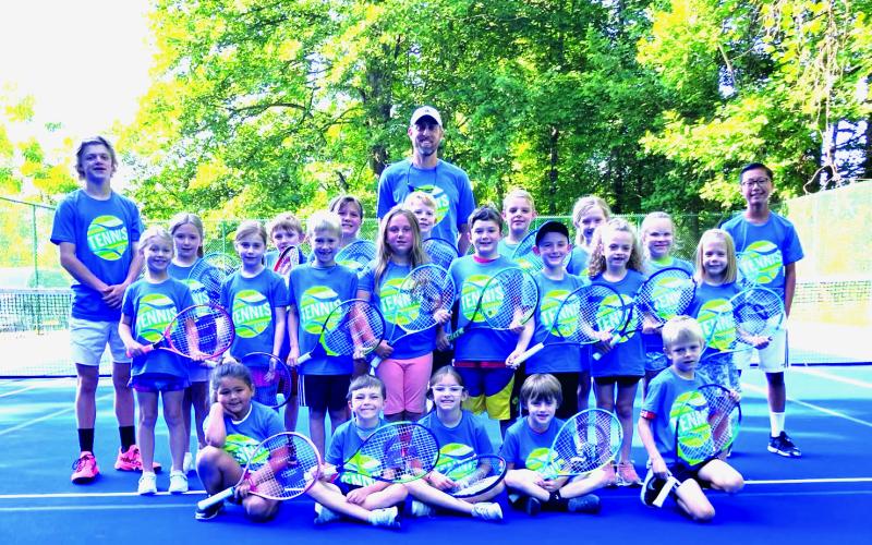 Photo courtesy Bryan Getty. Getty poses with the campers from the Summer Tennis Camp at Kingwood Resort. 