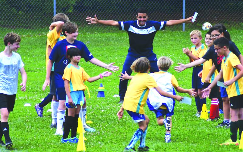 Enoch Autry/The Clayton Tribune. Claudio Lima waits for his campers to come in for a hug at the end of the camp held at Rabun County Recreation Department from June 19-23.
