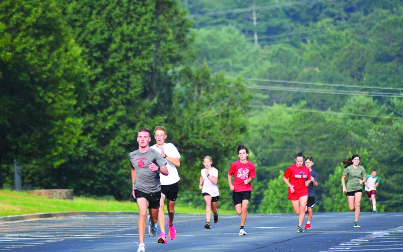 Enoch Autry/The Clayton Tribune. Hayden Smith finishes strong during the running of one of the cross country team’s 200-meter dashes.
