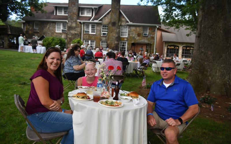 Megan Broome/The Clayton Tribune. Jason, Ashley and Emily Carmack travel to The Dillard House from Alabama to enjoy a cookout and live music on the Oaklawn during the Independence Day celebration July 3.