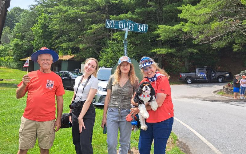Megan Broome/The Clayton Tribune. George Codreanu; Yuliia Poplavska; Elena Poplavska; and Diana Maus with her Cavalier King Charles Spaniel Jake attend Independence Day festivities in Sky Valley July 3.