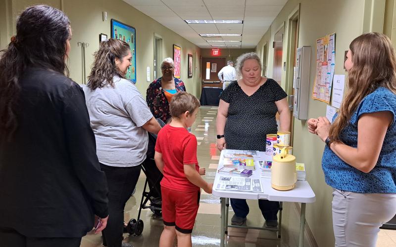 Megan Broome/The Clayton Tribune. Alyssa Hurt, CPA/Nutritionist and Dawnia Sanborn, WIC clerk, provide educational resources and information about Georgia Women, Infants, and Children (WIC), the nation’s fifth largest Special Supplemental Nutrition Program for Women, Infants and Children, at the Rabun County Health Department meet and greet event June 6.