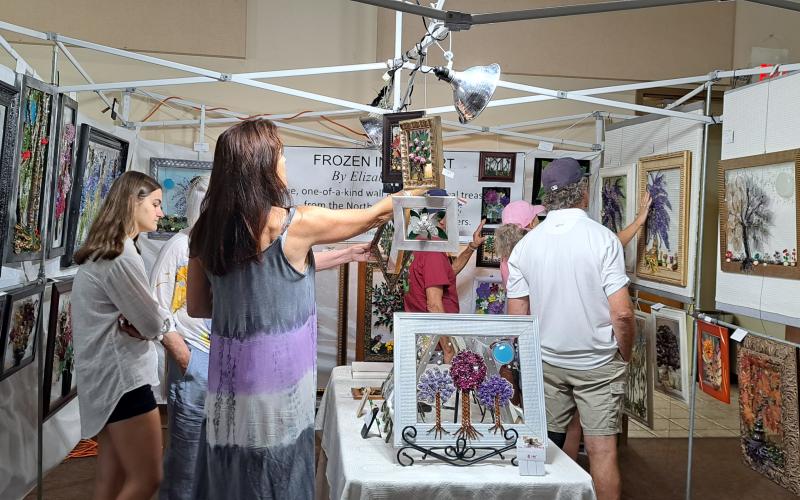 Megan Broome/The Clayton Tribune. Elizabeth Smith uses natural treasures, such as leaves, flowers and wood, from the North Georgia Mountains to create “Frozen In Time Art.”