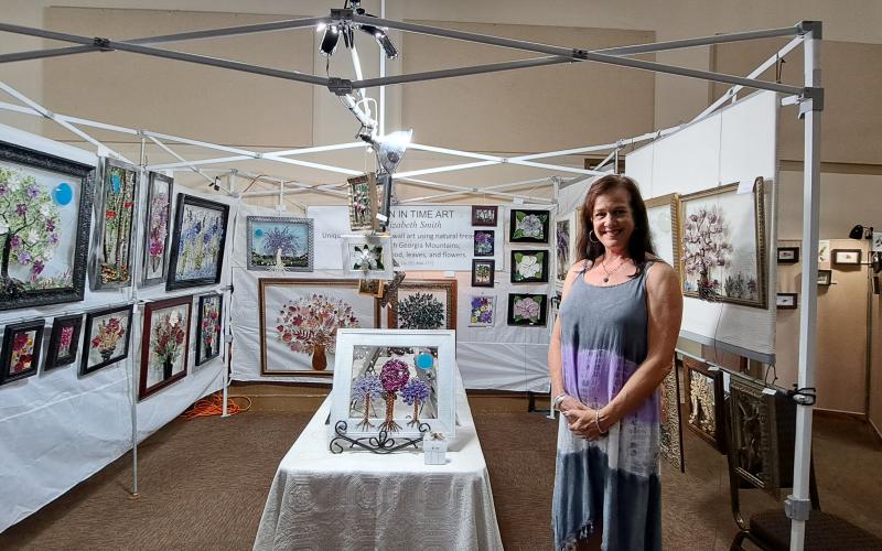 Megan Broome/The Clayton Tribune. Elizabeth Smith uses natural treasures, such as leaves, flowers and wood, from the North Georgia Mountains to create “Frozen In Time Art.”