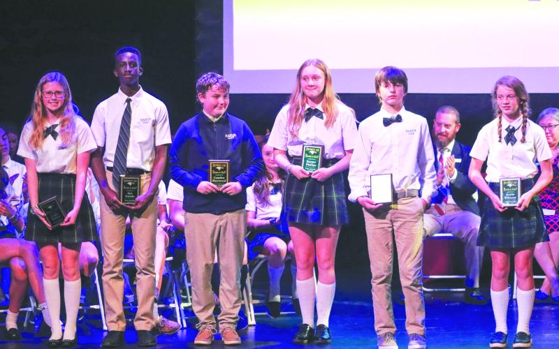 Submitted photo. Students pose with their Spirit of Rabun Gap Award. From left to right: Callie Parker of Franklin, N.C.; Ayo Iyanda of Atlanta; Camden Sherwood of Franklin, Ga.; Harper Phillips of Rabun Gap; Asa White of Rabun Gap; and Hattie Williams of Demorest, Ga.