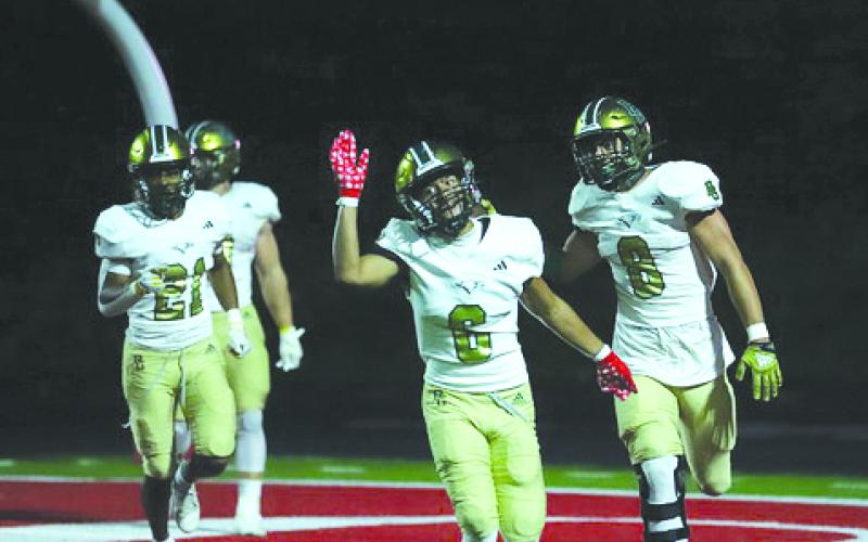Photo courtesy Christy Kirkpatrick. Rabun Gap-Nacoochee’s Patrick Williams (6) celebrates the Eagles’ scoop-and-score that led to the RGNS 35-24 over nationally ranked Baylor in Chattanooga on Aug. 18. The Eagles are at home on Aug. 25.