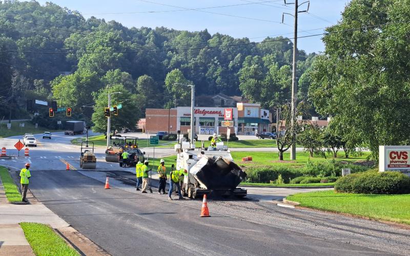 Megan Broome/The Clayton Tribune. C.W. Matthews Contracting Co. works to pave Chechero St. in Clayton Tuesday. The city of Clayton joined with the county on its paving bid. Duvall St. and Rickman St. are also on the schedule for paving.