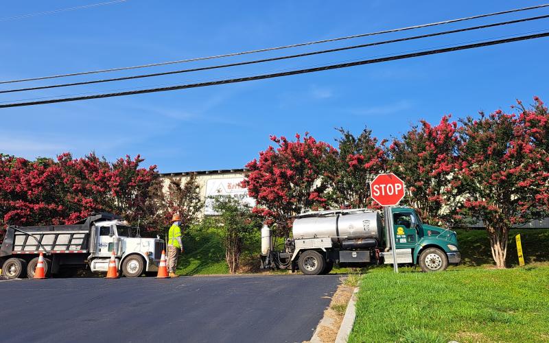 Megan Broome/The Clayton Tribune. C.W. Matthews Contracting Co. works to pave Chechero St. in Clayton Tuesday. The city of Clayton joined with the county on its paving bid. Duvall St. and Rickman St. are also on the schedule for paving.