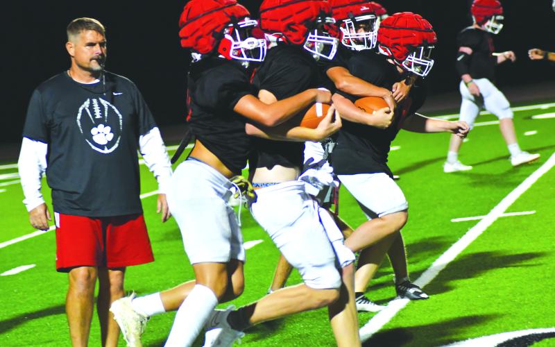 Enoch Autry/The Clayton Tribune. The Wildcats work on getting better at tackling and also stripping the ball away from runners.