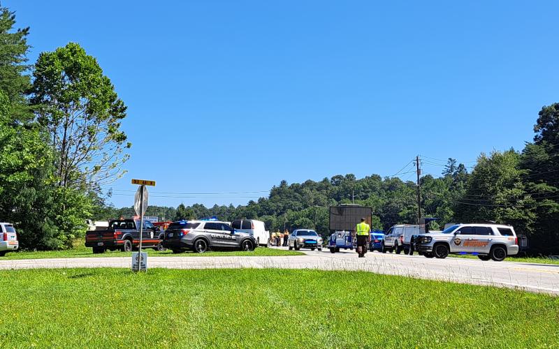 Megan Broome/The Clayton Tribune. Megan Broome/The Clayton Tribune. Rabun County agencies including Fire Services, EMS, Sheriff’s Office, Clayton Police Department, Search and Rescue (SAR) and the Coroner’s Office work the scene of a two-vehicle fatal crash involving a tractor trailer July 31. The area was taped off and surrounded by emergency vehicles. Northbound and southbound lanes were completely shut down for hours.Left: A memorial with flowers is displayed near the center aisles at the Clayton Ingles