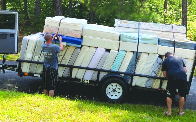 Submitted photo. The old mattresses are loaded up to be removed from campus.