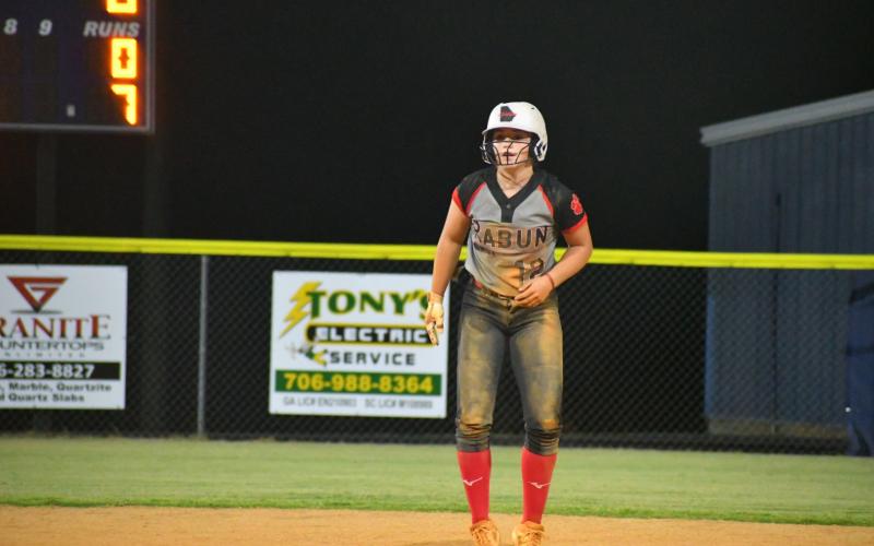 Wade Cheek The Clayton Tribune. RCHS shortstop Mili Watts taking a healthy lead at second base against Elbert County on Tuesday night.