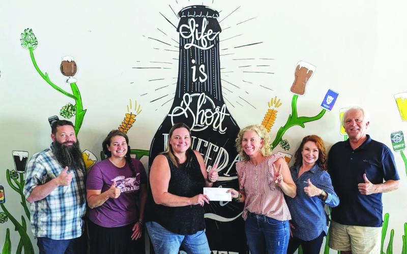 Submitted photo. Nonprofit Night at Currahee Brewing Company Aug. 3 raised $2,800 to benefit Rabun County Bands. Pictured are Scott Mazarky, Hillary Marshall, and Clayton Rotarians Ara Joyce, Mimi Tyson and Sheryl Webster.