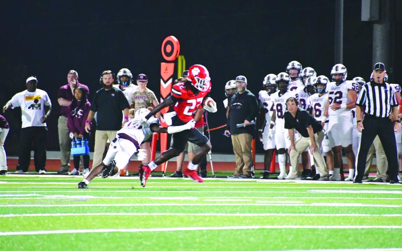 Wade Cheek/The Clayton Tribune. University of Cincinnati commit Willie Goodwyn unsurprisingly breaks away for a 60-yard touchdown reception against the Braves last Friday night. Goodwyn had two touchdown catches of at least 40 yards in the 45-13 win.