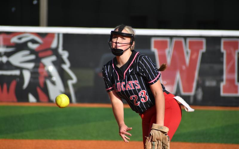 Wade Cheek/The Clayton Tribune. Pitcher Presley Burrell pitches a one-run complete game against Gainesville High School Tuesday evening as she struck out four Red Elephants.