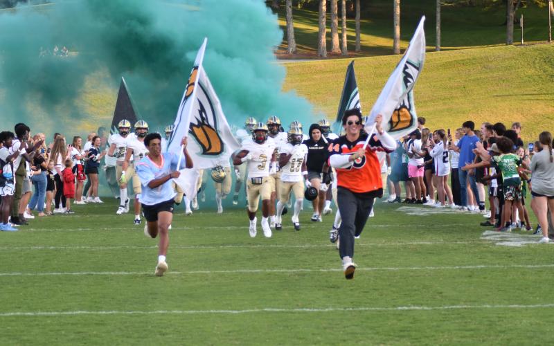 Enoch Autry/The Clayton Tribune. Wearing various types of jerseys, Rabun Gap-Nacoochee students bring the Eagles onto the football field on Sept. 15 to host Valor Christian from Highlands Ranch, Colo., on “Jersey Night.” The Eagles of Rabun Gap won the contest 52-31 to move to 5-0 on the season for the first time in school history. RGNS will be on the road in Robbinsville, N.C., Friday.