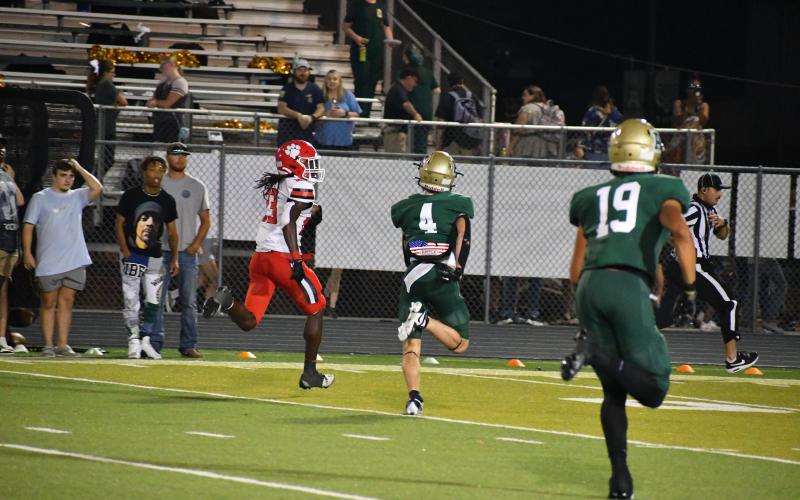 Wade Cheek/The Clayton Tribune. Rabun County defensive back Willie Goodwyn escapes from Adairsville defenders en route to scoring his first touchdown in last Friday's 35-20 victory over the Tigers.