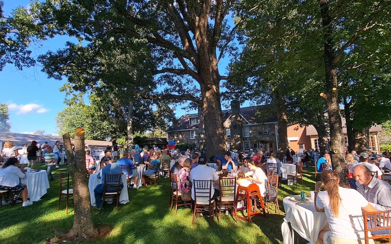 Megan Horn/The Clayton Tribune. Over 200 people were fed at The Dillard House Sunday, Sept. 3 for a Labor Day cookout on the Rock House Oaklawn. Attendees enjoyed live entertainment by Hunter Grayson and many different types of food.