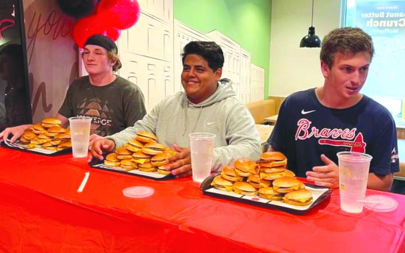 Submitted. Rueben Fuentes (center) prepares for the event with his teammates/competitors Alex Yearwood and Carver Jarrard.