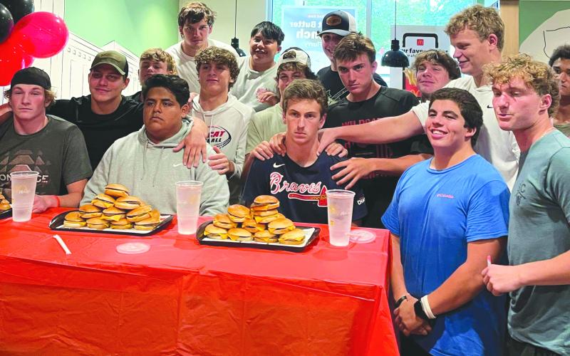 Submitted.  Rabun County Wildcats pose with their football teammates Alex Yearwood, Rueben Fuentes and Carver Jarrard before the start of the cheeseburger eating contest.