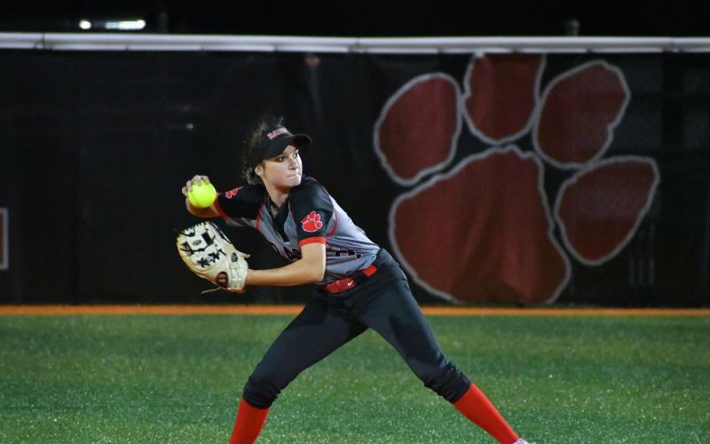 Wade Cheek/The Clayton Tribune. Lady Cat second baseman Hailey Harvey prepares to throw out a Commerce baserunner .