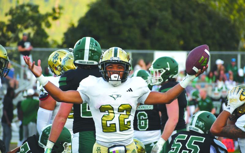 Wade Cheek/The Clayton Tribune. RGNS senior Tyrell Campbell celebrates after diving into the end zone for the Eagles’ first score in last Friday’s 42-21 victory over Christ School.
