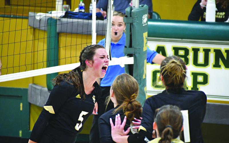 Wade Cheek/The Clayton Tribune. Eagle senior Peyton Brady (5) screams with her teammates while celebrating an Rabun Gap-Nacoochee point against Rabun County on Aug. 31. RGNS currently is ranked No. 7.