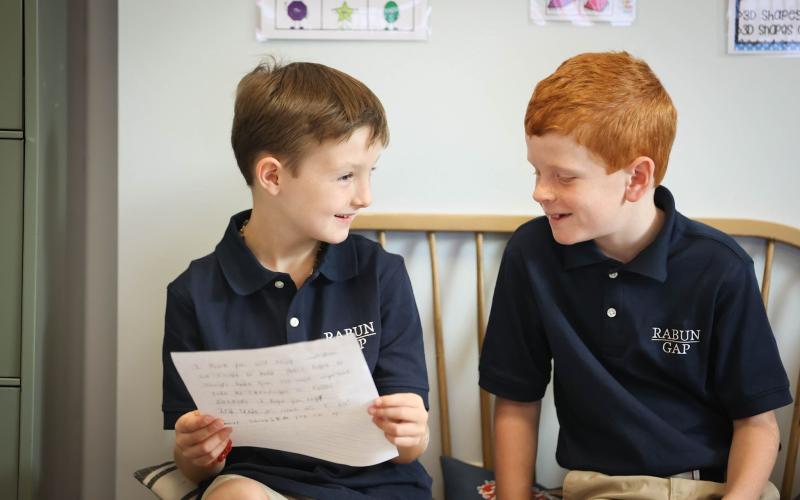 Photo courtesy Rabun Gap-Nacoochee School. Alex Thornton ’34  and Thomas Meadors '34, of Rabun Gap, GA, in class on the first day of school at Rabun Gap-Nacoochee School. Rabun Gap welcomed back 675 students on August 23.
