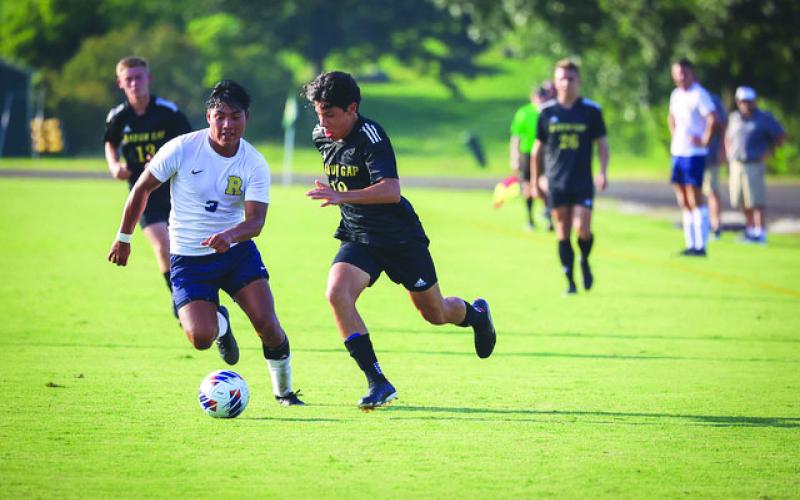 RGNS Athletics. RGNS sophomore Gabriel Ruelas races to the penalty area against TC Robertson on Aug. 22.