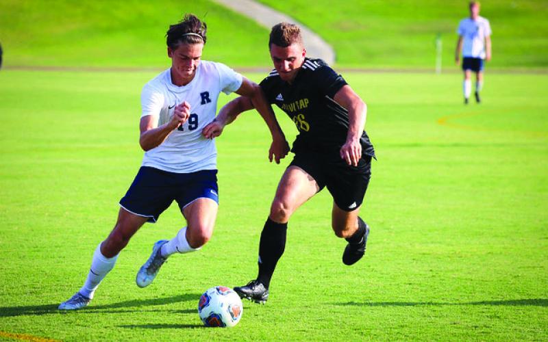 RGNS Athletics. Eagle senior Filip Matic attempts to regain possession against TC Robertson on Aug. 22.