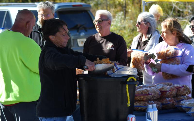 Enoch Autry/The Clayton Tribune. A picture-perfect day greeted people at the annual Sky Valley Fall Festival on Oct. 21. Below: Third place in the Hay Bale Trail competition went to Bartram Trail Conservancy for their hay bale shaped like a shoe with animals that promoted hiking the trail and staying active.
