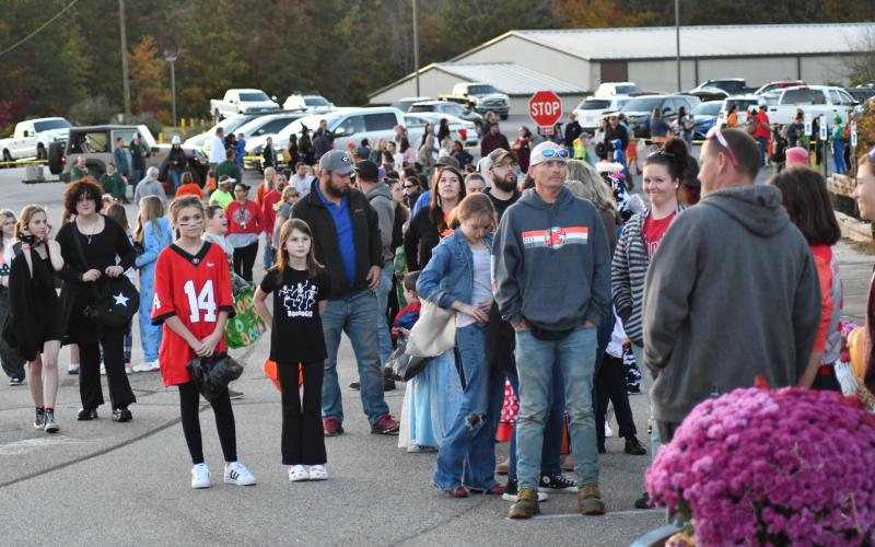 Enoch Autry/The Clayton Tribune. The sun may have been going down in Rabun County on Oct. 23, but thousands were out in search of bags of candy.Below: Enoch Autry/The Clayton Tribune. Popeye loves his spinach, but he must enjoy some candy too. Isaiah Brown, 3, is dressed as the strong man as he strolls with his family and his 6-year-old sister Isabella Brown who portrayed the role of Olive Oil.