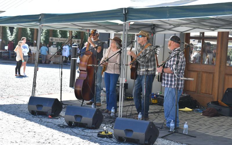 Megan Horn/The Clayton Tribune. The band Carolina Backroads performs during the Foxfire Mountaineer Festival last weekend. Live music was featured throughout the day as thousands of attendees tap danced their way through the festival.